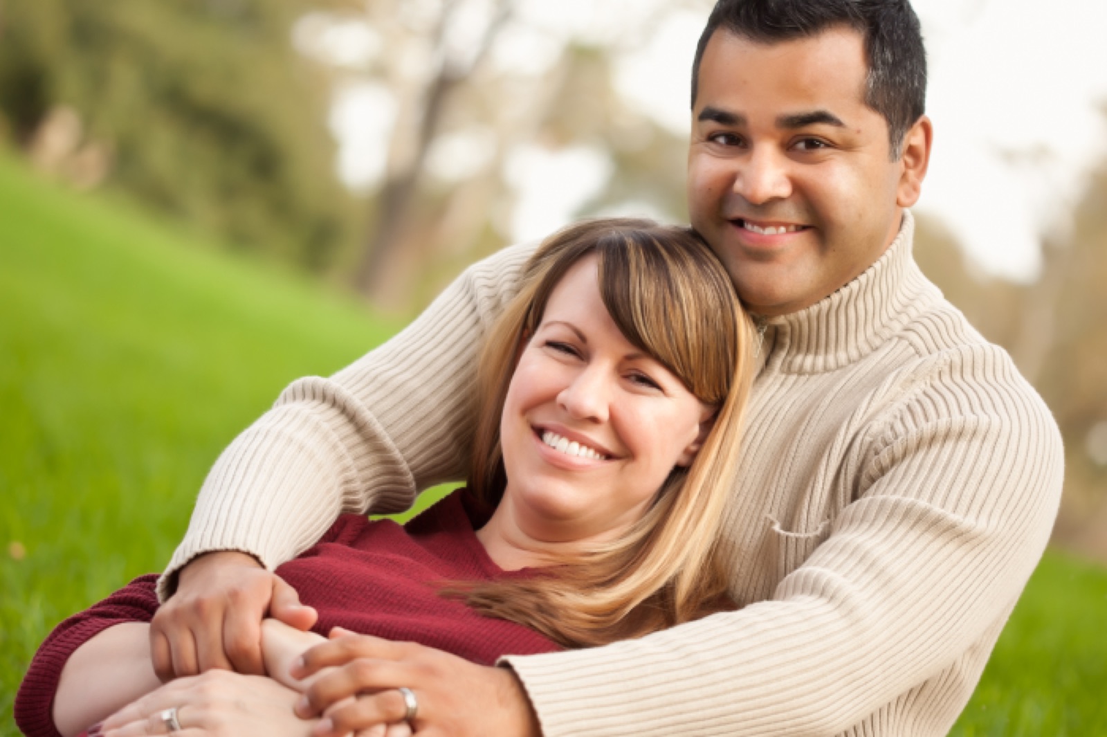 A couple smiling together outdoors